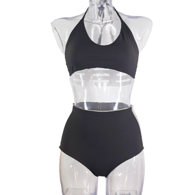 Saturno bikini moka sandal, moka sandal and back white sport triangle bikini and high-waisted bottom, a retro yet timeless piece of clothing suitable for large breasts.